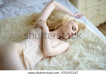 Nude blonde girl sleeping naked
