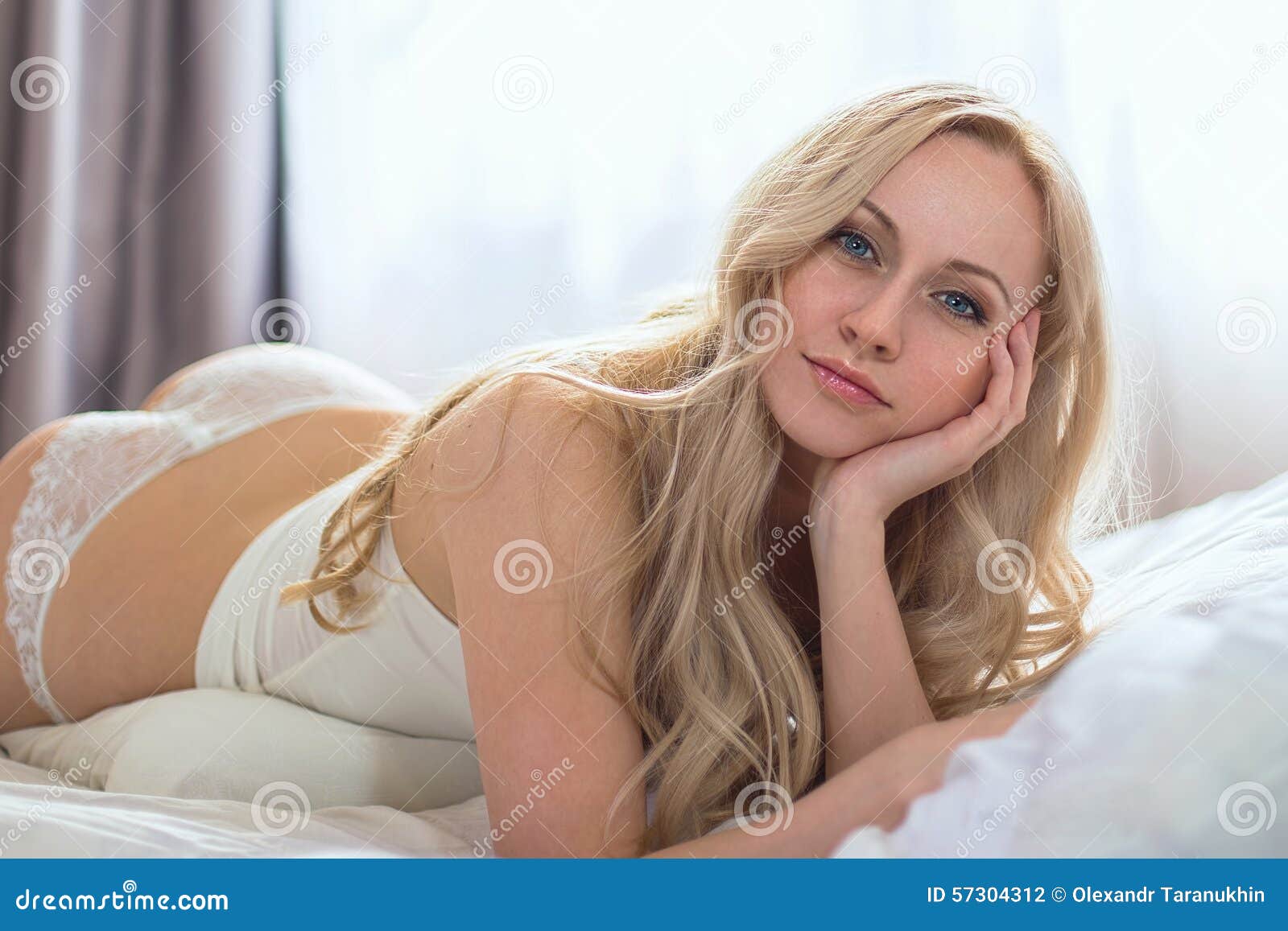 Beautiful nude blonde women on beds