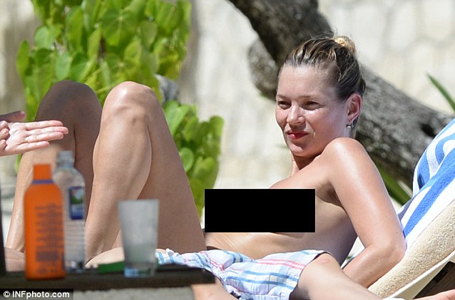 Kate moss sunbathing topless