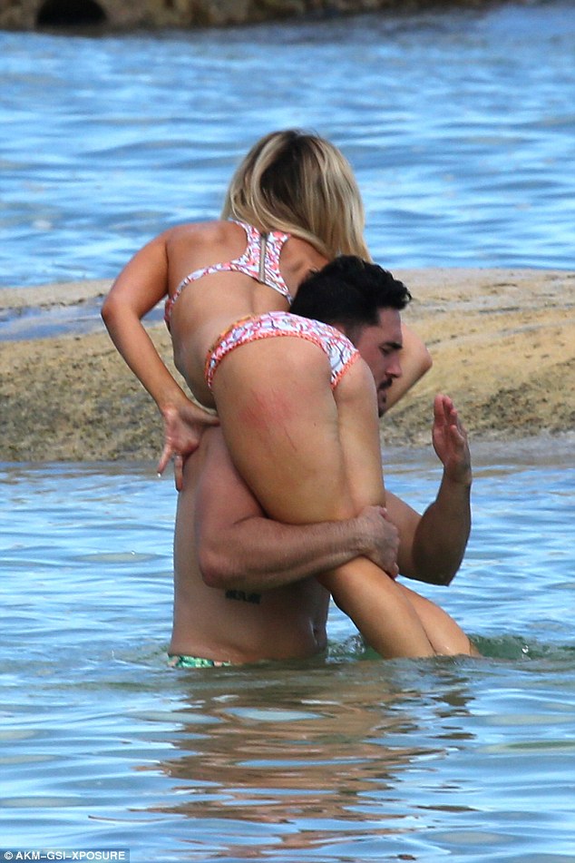 Girls getting a spanking on the beach
