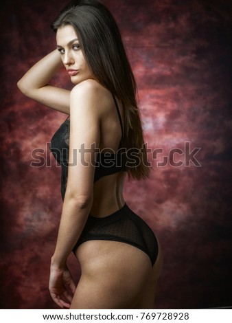 Brunette with whip posing