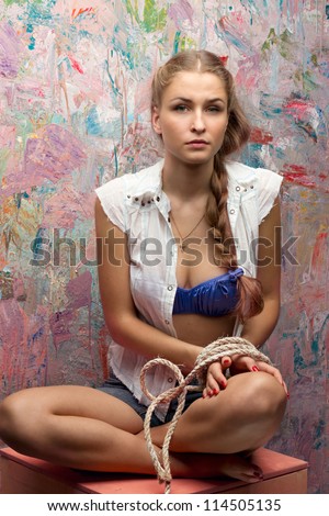 Girl tied up with rope