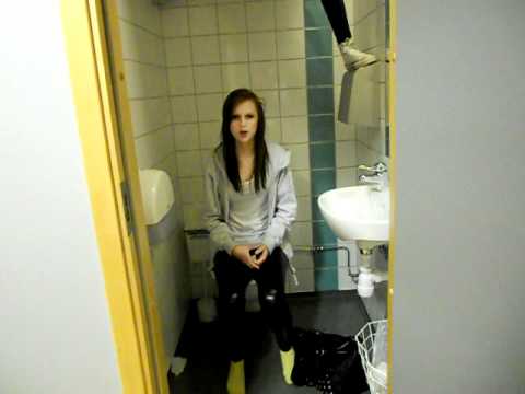 Girl sitting on toilet